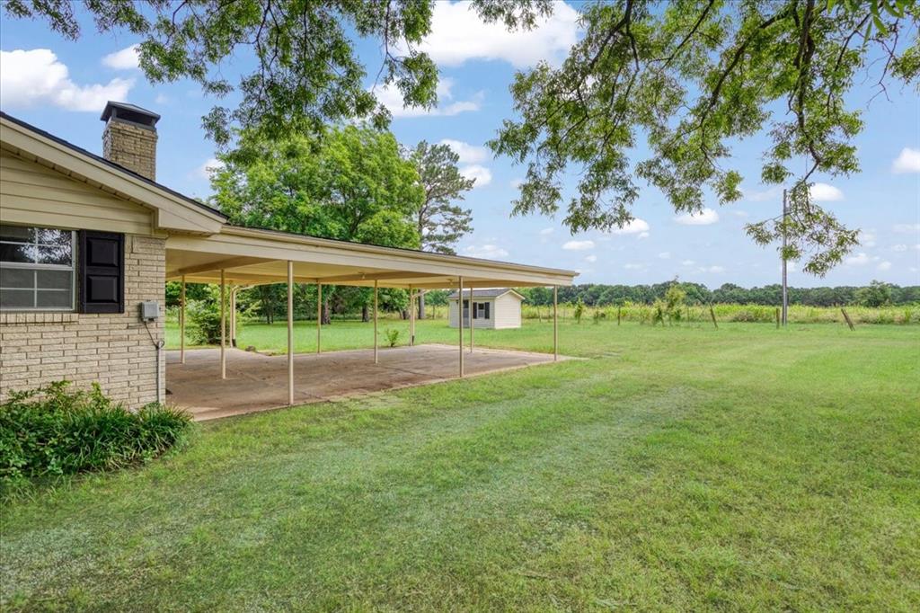 4400 Highway 121 Bonham, TX 75418 - Photo 10 of 40 a view of a house with a yard