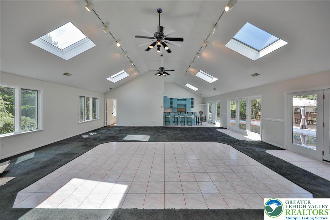 1015 Honeysuckle Road Walnutport, PA 18088 - Photo 15 of 75 a view of an empty room with a window and wooden floor