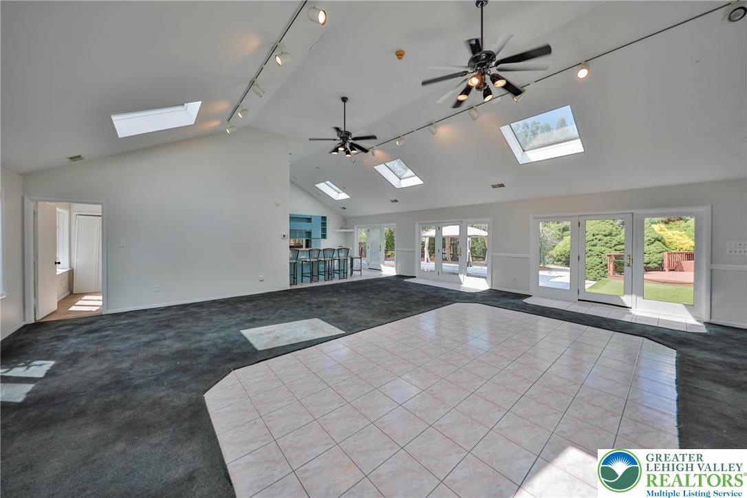 1015 Honeysuckle Road Walnutport, PA 18088 - Photo 16 of 75 a view of a livingroom with furniture ceiling fan and window