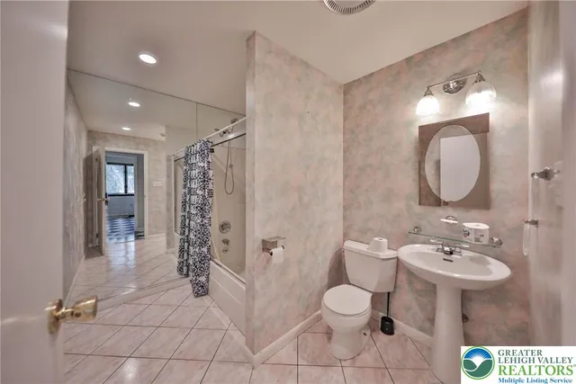 a view of a living room with a black white checkered floor