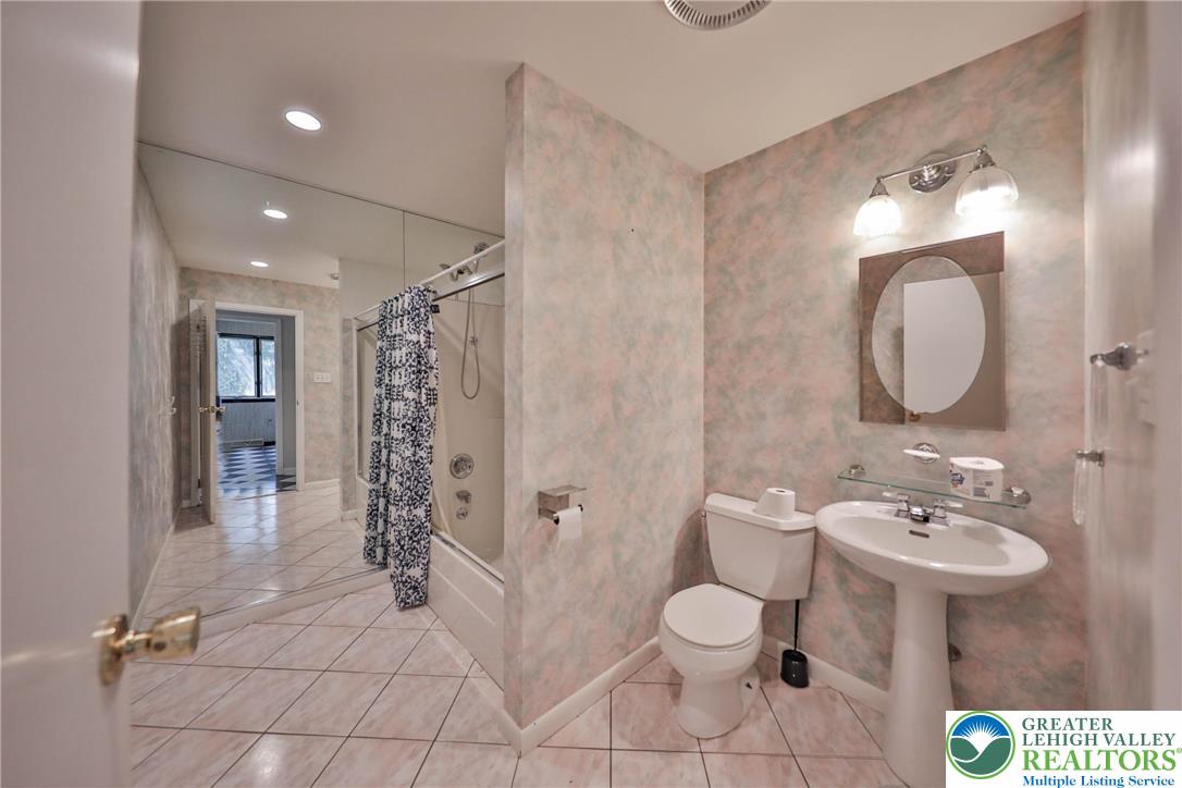 1015 Honeysuckle Road Walnutport, PA 18088 - Photo 22 of 75 a spacious bathroom with a toilet sink and shower