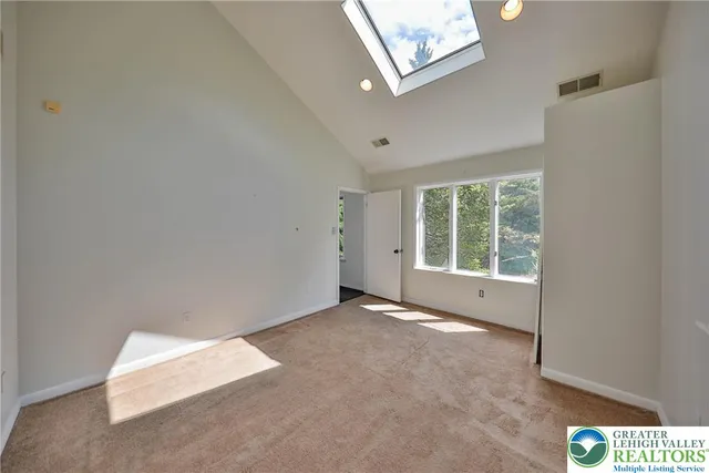 a bathroom with a sink toilet and a mirror