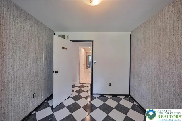 a view of a house with roof deck front of house