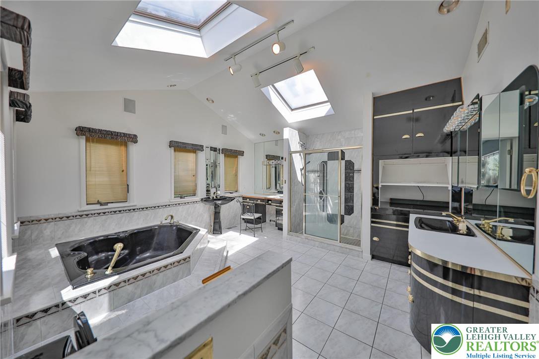 1015 Honeysuckle Road Walnutport, PA 18088 - Photo 42 of 75 a kitchen with a stove a sink and a refrigerator