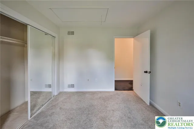 a view of a wooden deck with a yard