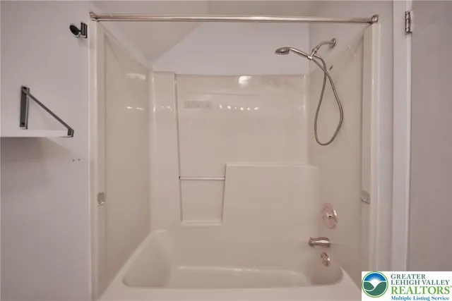 a front view of house with deck and yard