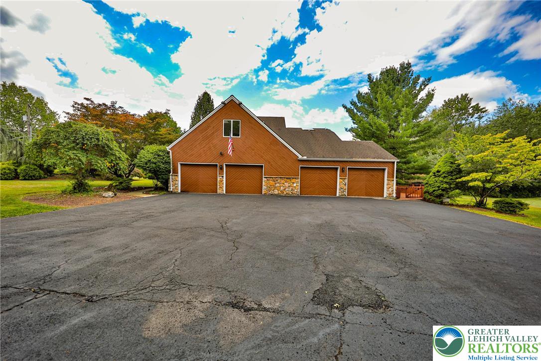 1015 Honeysuckle Road Walnutport, PA 18088 - Photo 6 of 75 a view of a house with a yard and garage