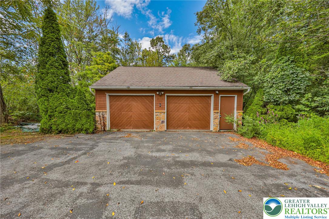1015 Honeysuckle Road Walnutport, PA 18088 - Photo 64 of 75 a house with trees in the background