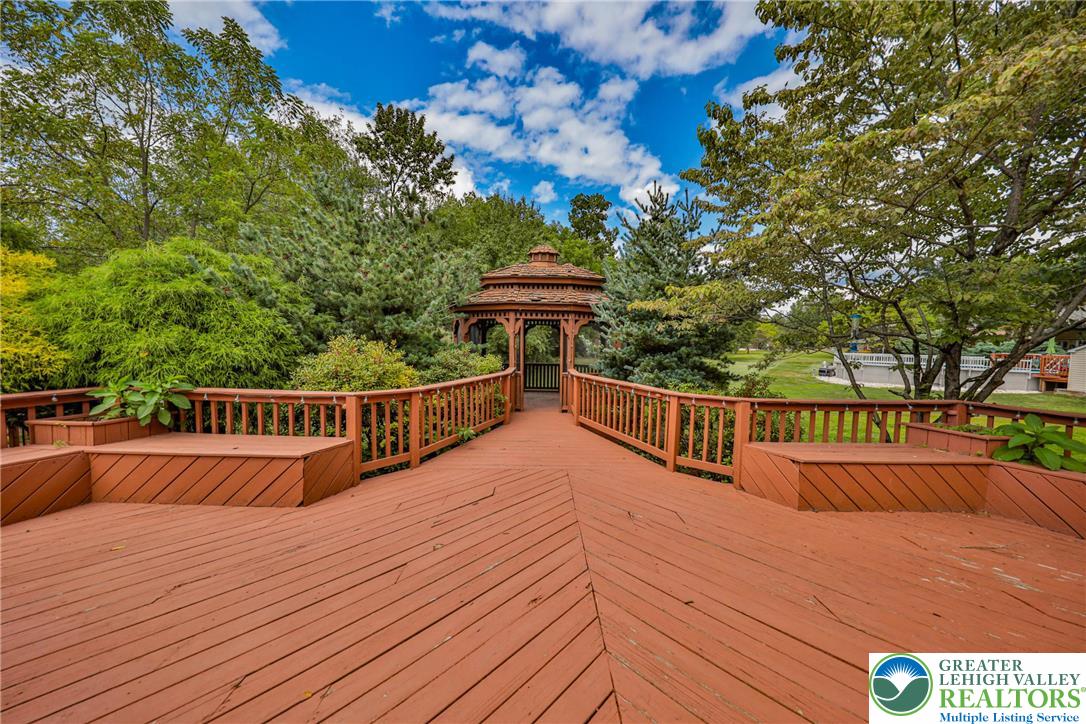 1015 Honeysuckle Road Walnutport, PA 18088 - Photo 66 of 75 a view of a wooden deck with a yard