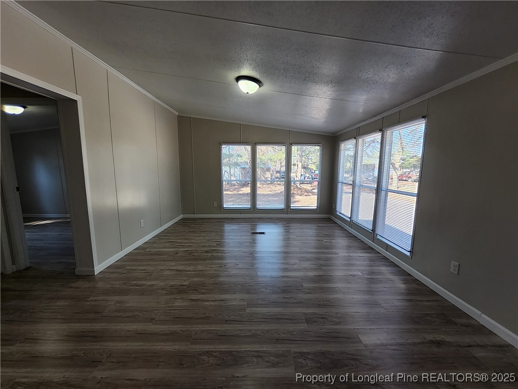 87 Drox Lane Clinton, NC 28328 - Photo 13 of 22 a view of empty room with wooden floor and fan