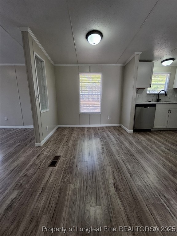 87 Drox Lane Clinton, NC 28328 - Photo 15 of 22 an empty room with wooden floor and windows