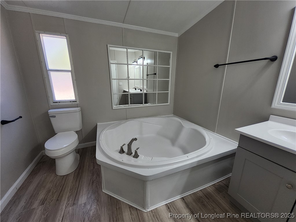 87 Drox Lane Clinton, NC 28328 - Photo 20 of 22 a white bath tub sitting next to a white toilet