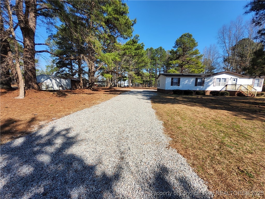 87 Drox Lane Clinton, NC 28328 - Photo 2 of 22 a view of a house with a yard