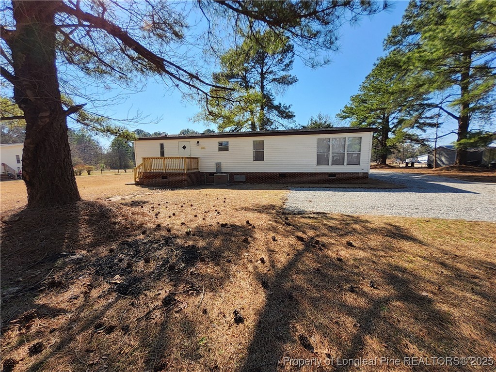 87 Drox Lane Clinton, NC 28328 - Photo 3 of 22 a view of a back yard of the house
