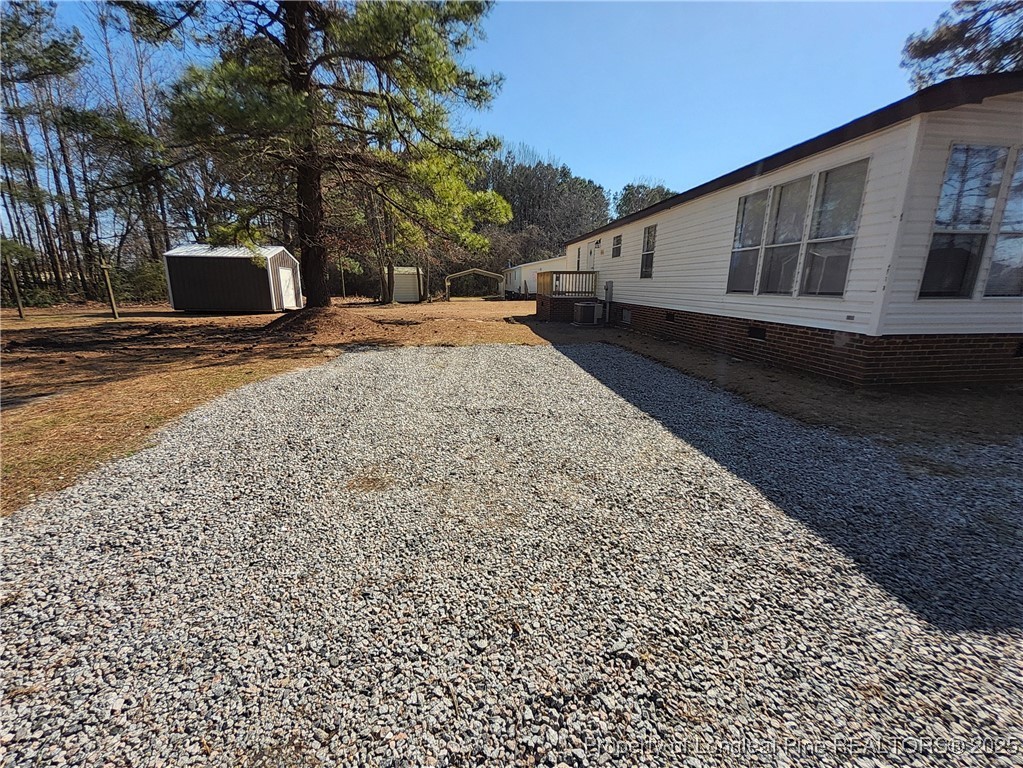 87 Drox Lane Clinton, NC 28328 - Photo 4 of 22 a view of a house with a yard