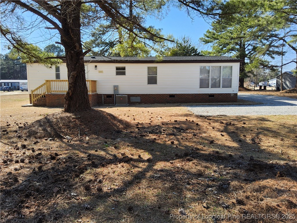 87 Drox Lane Clinton, NC 28328 - Photo 7 of 22 a house view with a backyard space