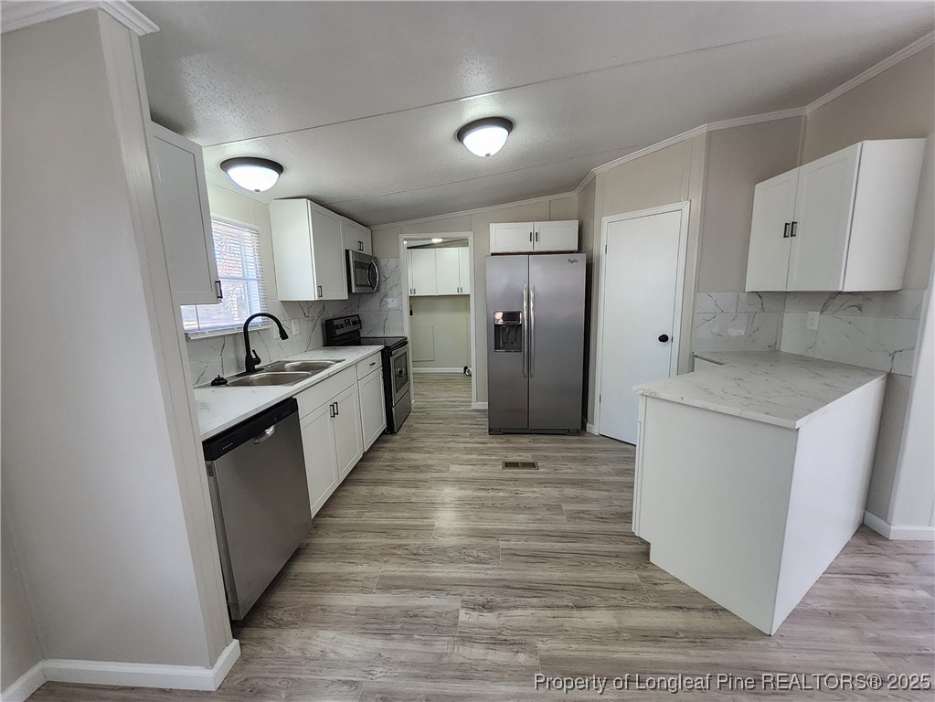 87 Drox Lane Clinton, NC 28328 - Photo 10 of 22 a kitchen with sink a refrigerator and cabinets
