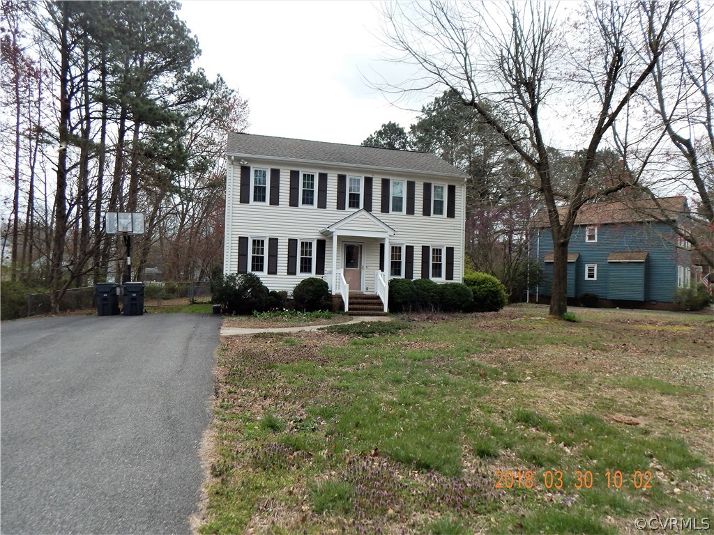 1427 Austin Road Chester, VA 23836 - Photo 2 of 5 a view of a yard in front of a house