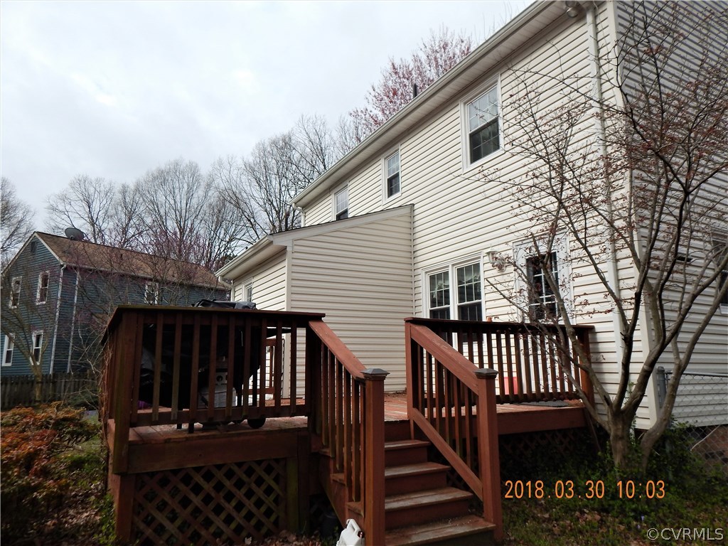 1427 Austin Road Chester, VA 23836 - Photo 4 of 5 a view of a house with backyard and deck