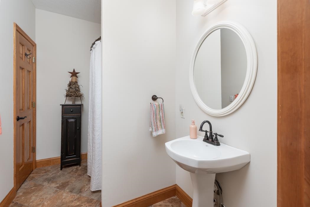 1049 Tinkling Spring Road Staunton, VA 24401 - Photo 17 of 75 a bathroom with a sink and a mirror