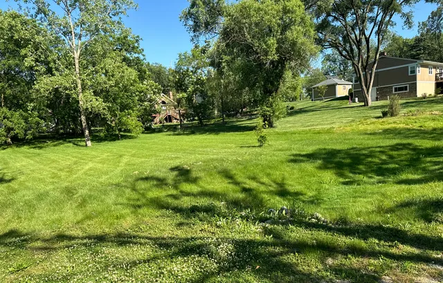 a backyard of a house with lots of green space