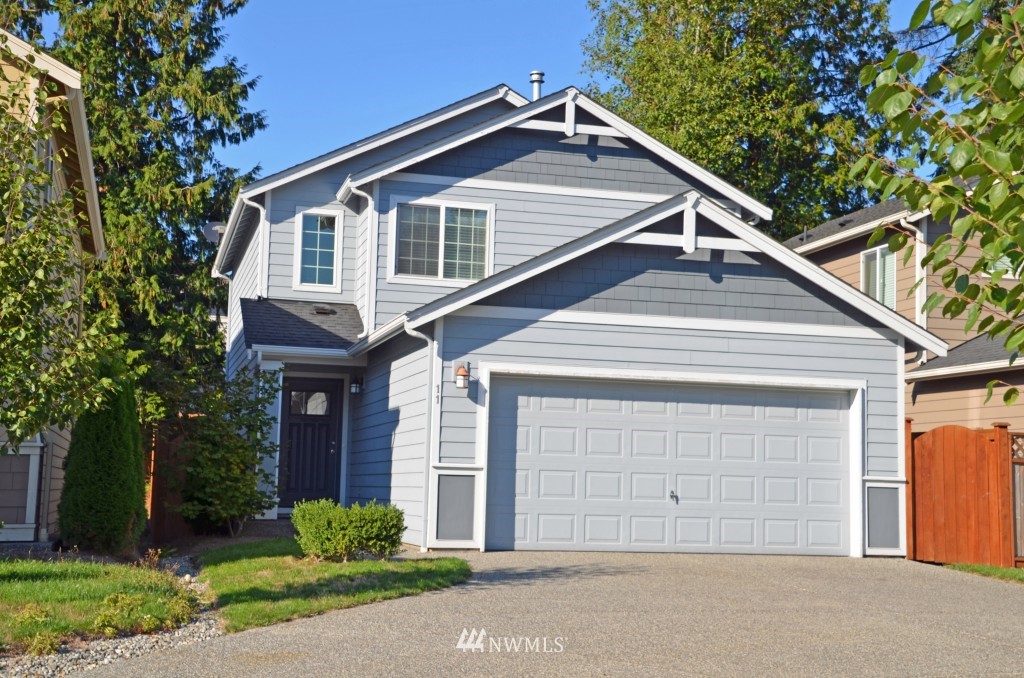11 194th Street Southwest Bothell, WA 98012 - Photo 1 of 10 a front view of a house with a yard and garage