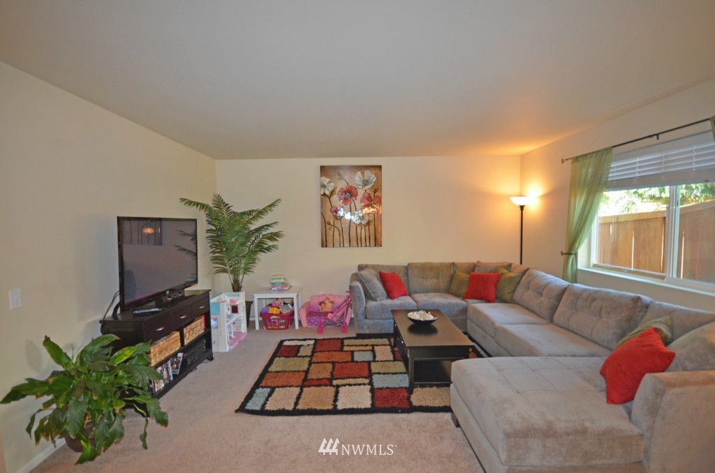 11 194th Street Southwest Bothell, WA 98012 - Photo 5 of 10 a living room with furniture and a flat screen tv