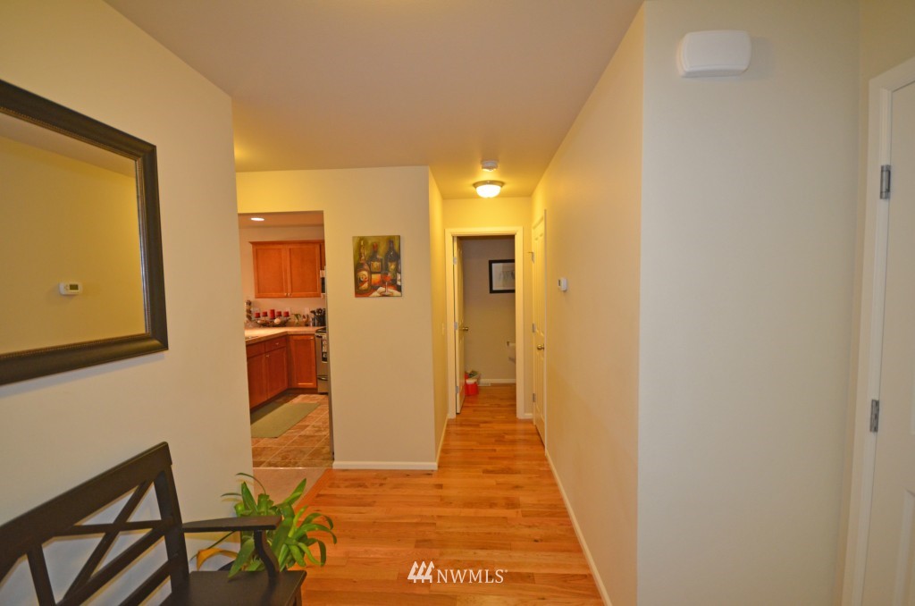 11 194th Street Southwest Bothell, WA 98012 - Photo 6 of 10 a view of a hallway with wooden floor