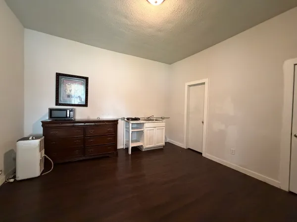 a view of a livingroom with furniture and wooden floor