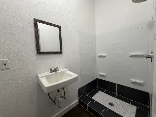 a bathroom with a sink and a mirror