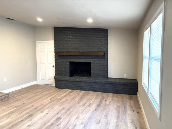 a view of an empty room with a window