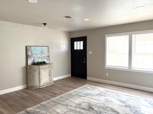 a kitchen with stainless steel appliances granite countertop a refrigerator and a stove