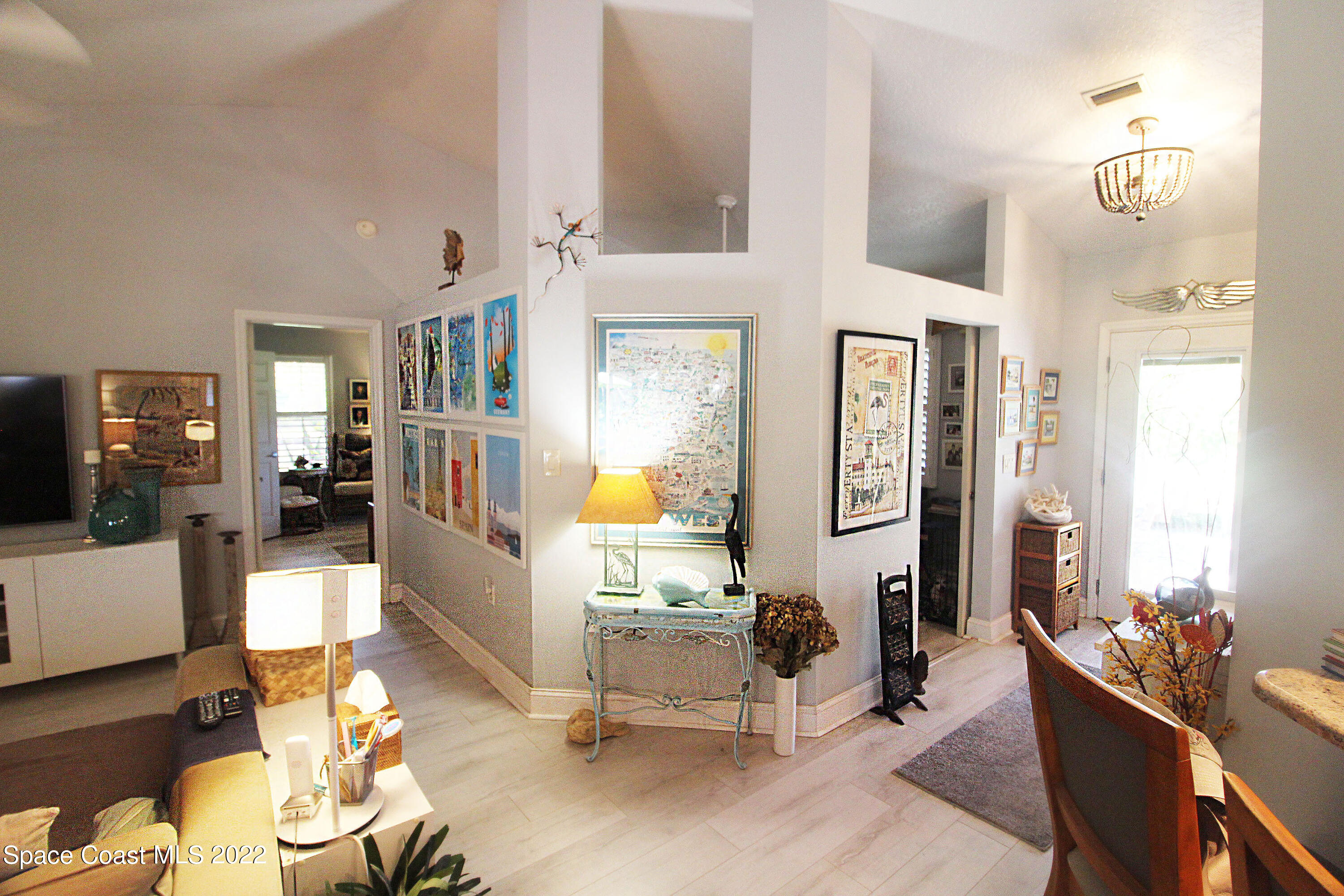 2397 Chase Hammock Road Merritt Island, FL 32953 - Photo 11 of 35 a living room with furniture and a table