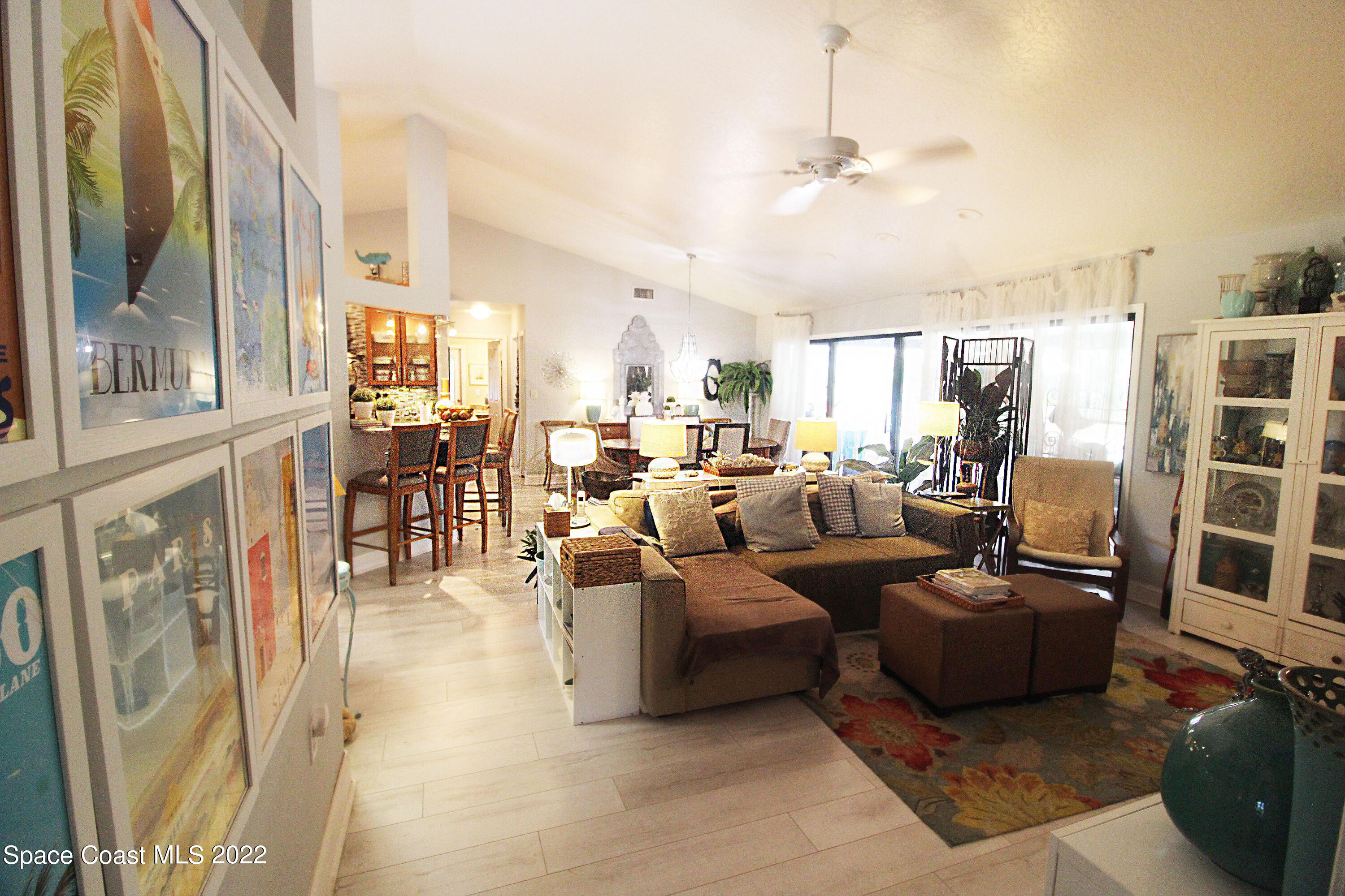 2397 Chase Hammock Road Merritt Island, FL 32953 - Photo 14 of 35 a living room with furniture and a large window