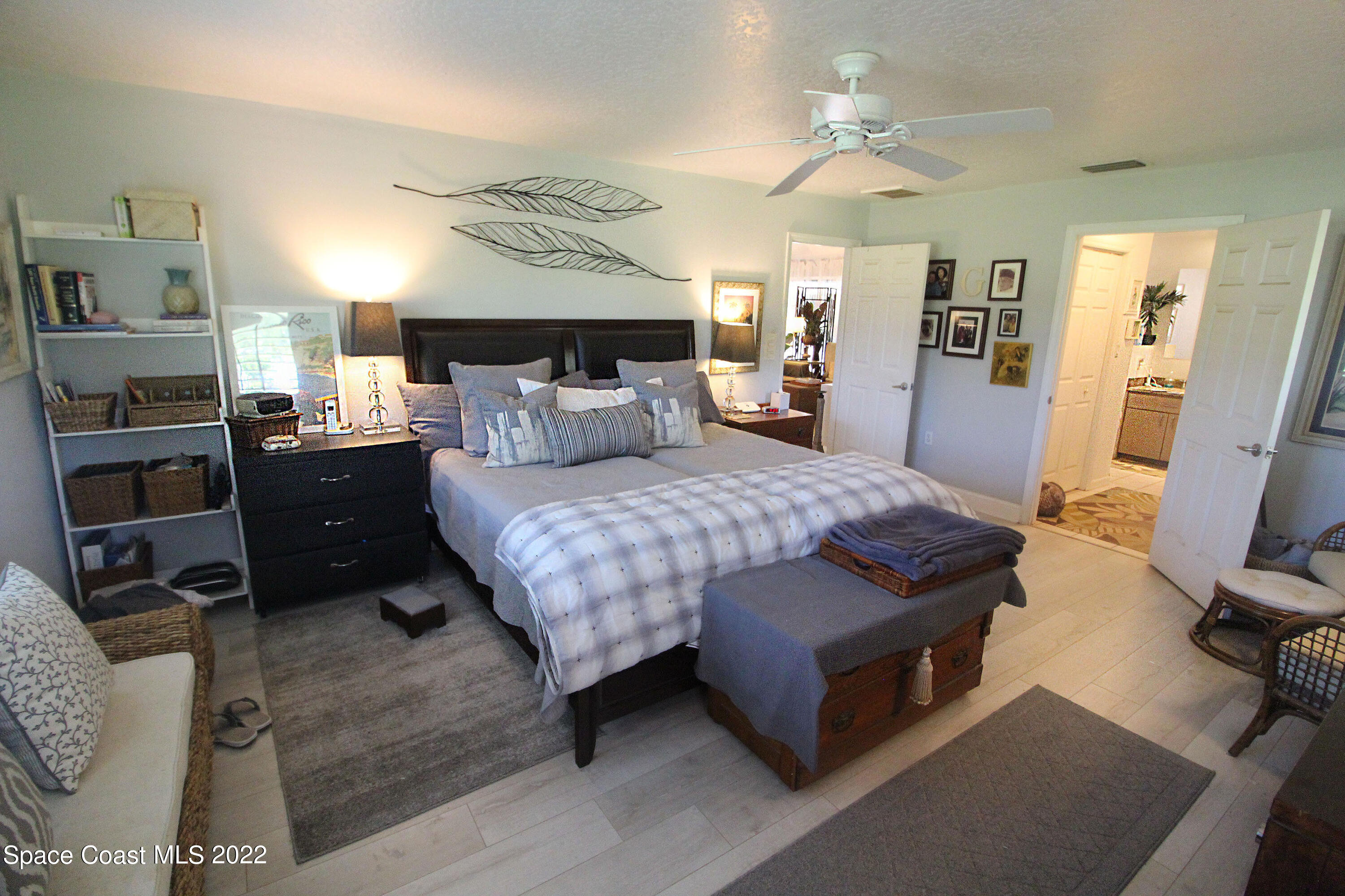 2397 Chase Hammock Road Merritt Island, FL 32953 - Photo 24 of 35 a bedroom with a bed and a television in it