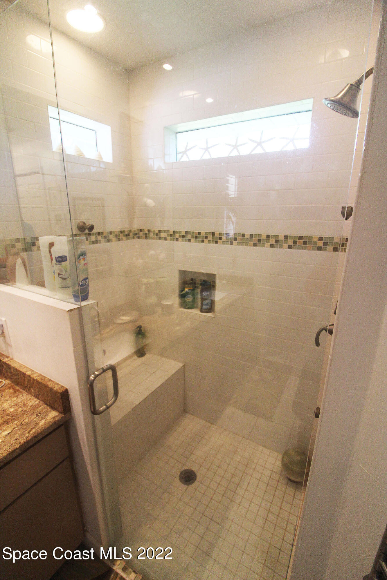 2397 Chase Hammock Road Merritt Island, FL 32953 - Photo 29 of 35 a bathroom with a sink a toilet and a shower