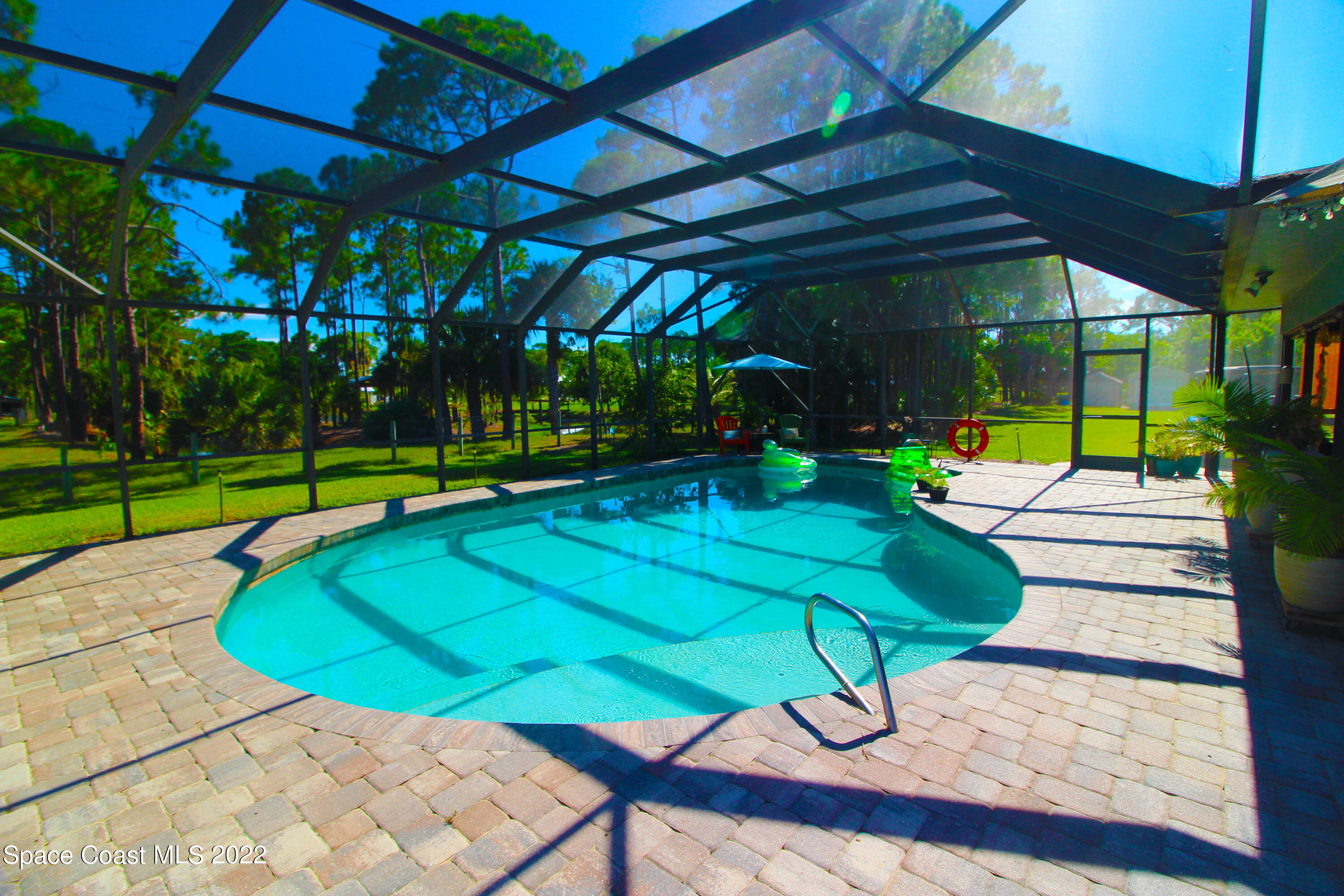 2397 Chase Hammock Road Merritt Island, FL 32953 - Photo 33 of 35 a view of a backyard with swimming pool