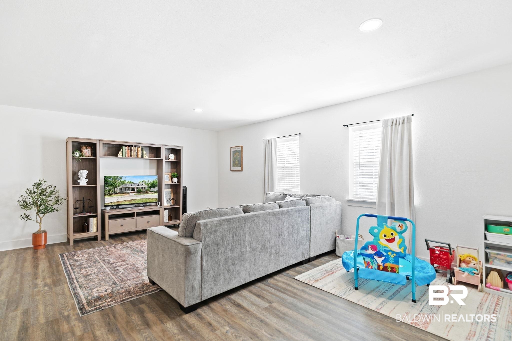 342 Ridgewood Drive Daphne, AL 36526 - Photo 25 of 36 Living room featuring dark hardwood / wood-style floors