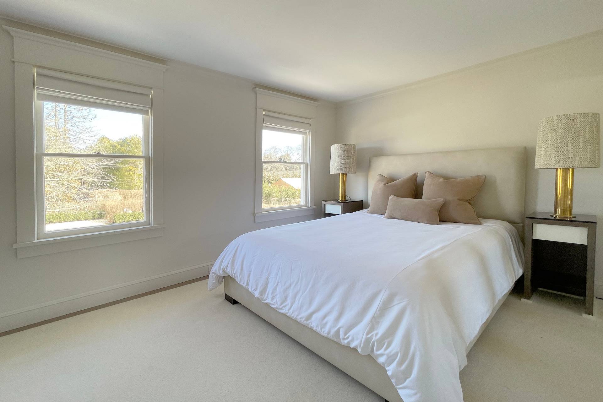 67 Norris Lane Bridgehampton, NY 11937 - Photo 17 of 32 a bed sitting in a bedroom next to a window