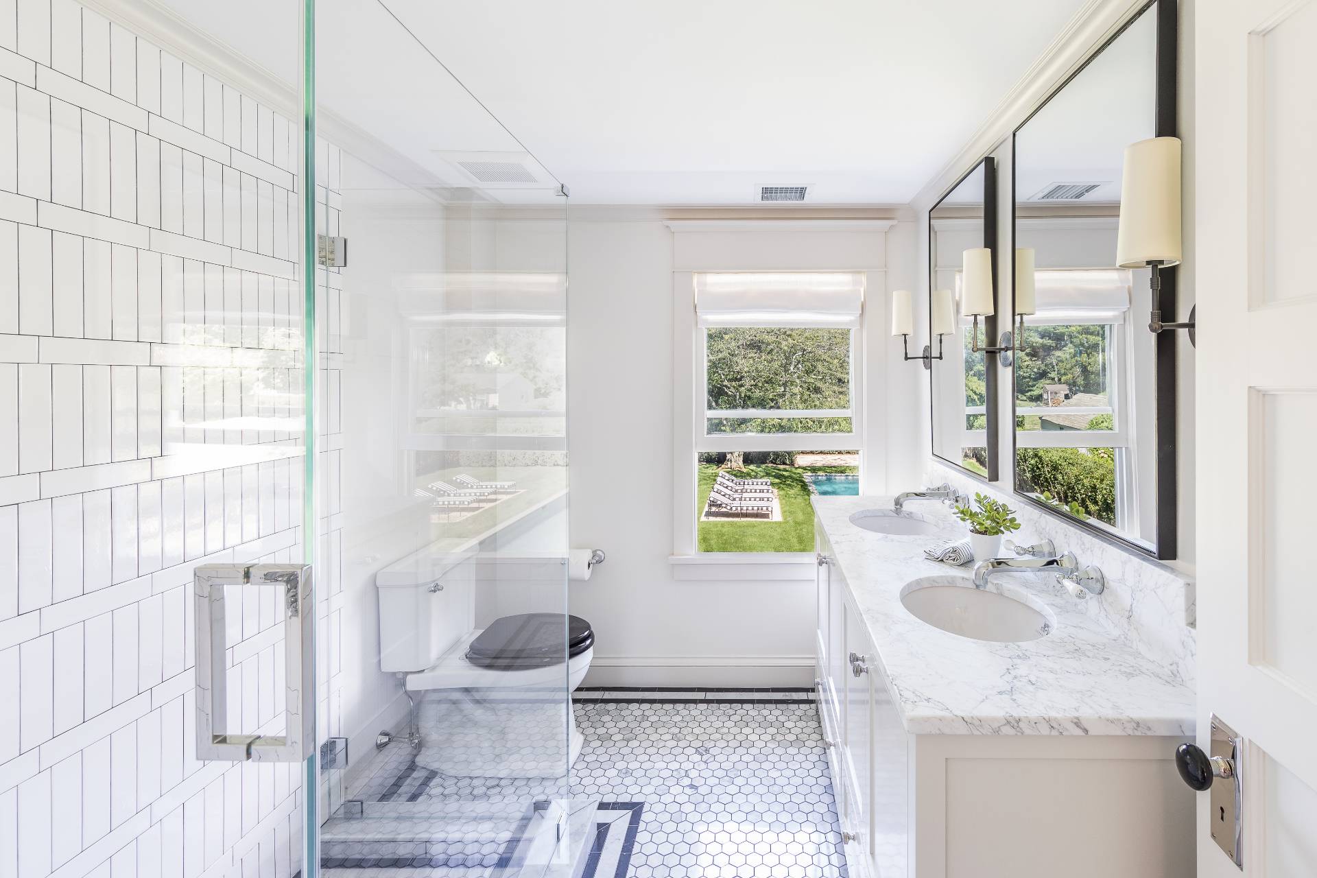 67 Norris Lane Bridgehampton, NY 11937 - Photo 22 of 32 a bathroom with a granite countertop sink toilet and mirror
