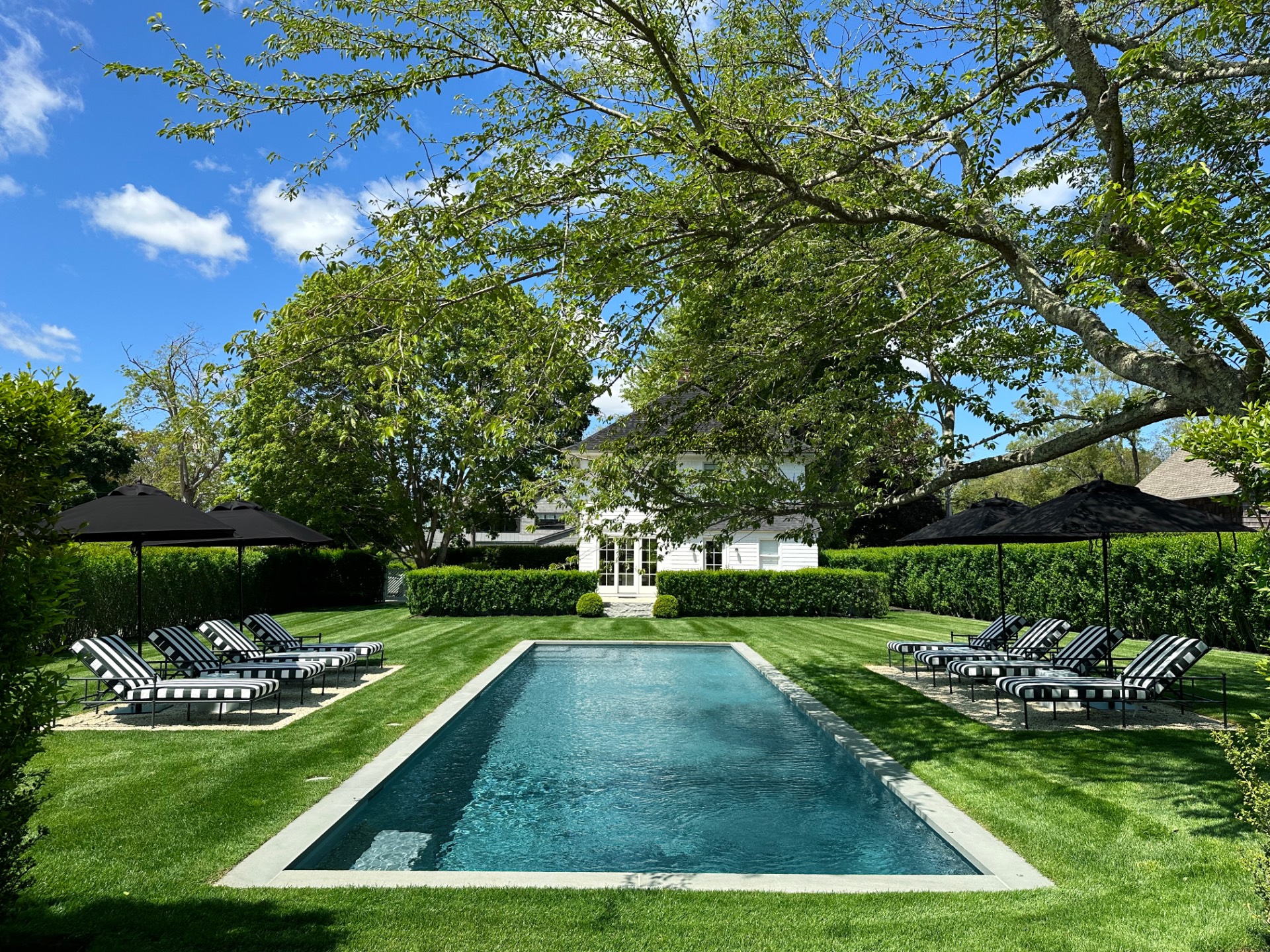 67 Norris Lane Bridgehampton, NY 11937 - Photo 25 of 32 a view of a backyard with sitting area