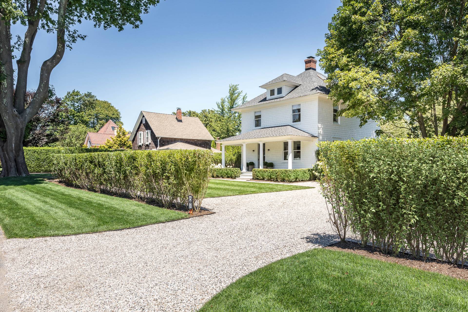 67 Norris Lane Bridgehampton, NY 11937 - Photo 28 of 32 a front view of a house with a garden