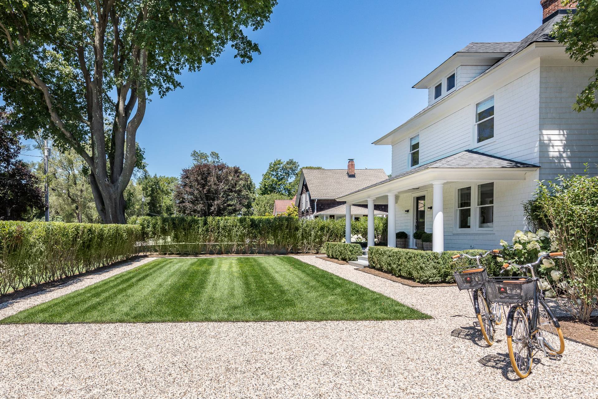 67 Norris Lane Bridgehampton, NY 11937 - Photo 29 of 32 a front view of a house with a yard