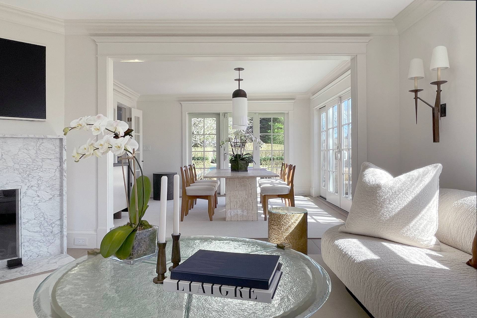 67 Norris Lane Bridgehampton, NY 11937 - Photo 7 of 32 a living room with furniture a chandelier and a rug