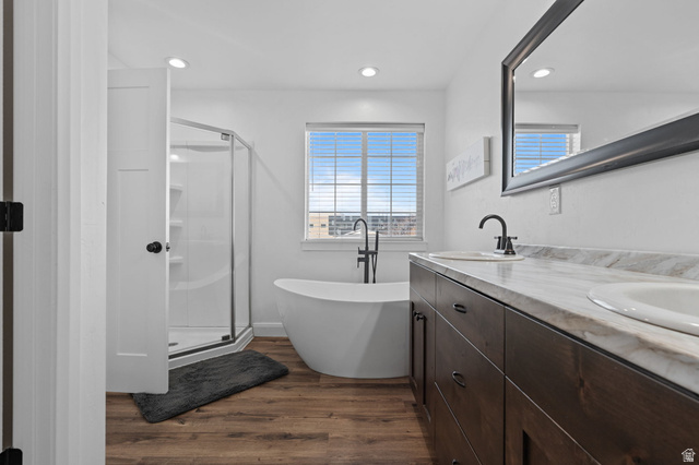 75 North 100th Street West Fillmore, UT 84631 - Photo 15 of 62 Full bath featuring double vanity, a soaking tub, dark wood-style floors, a stall shower, and recessed lighting