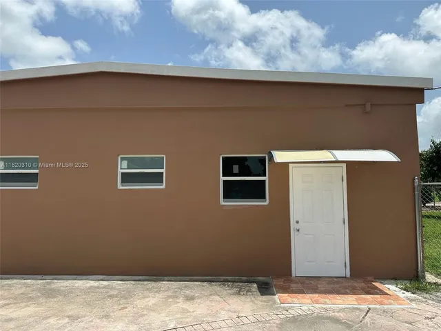 a view of a livingroom with an empty space and wooden floor