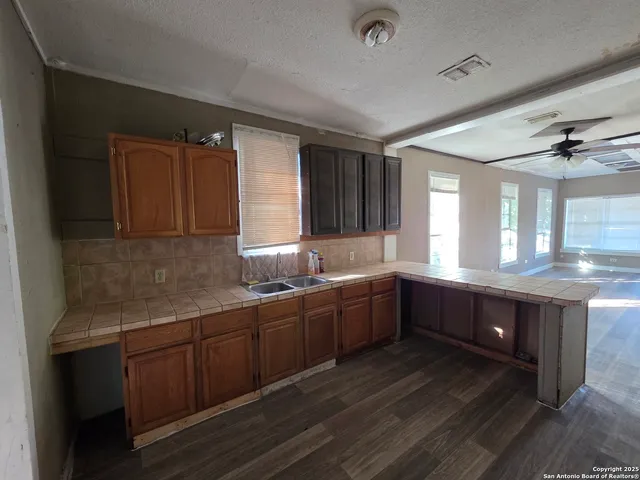 a large bathroom with double vanity and a large mirror