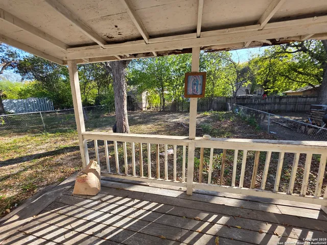 a porch with wooden floor in outdoor space