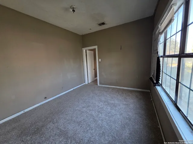 an empty room with windows