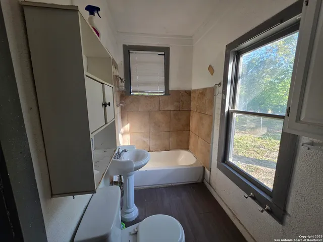 a bathroom with a sink and bathtub